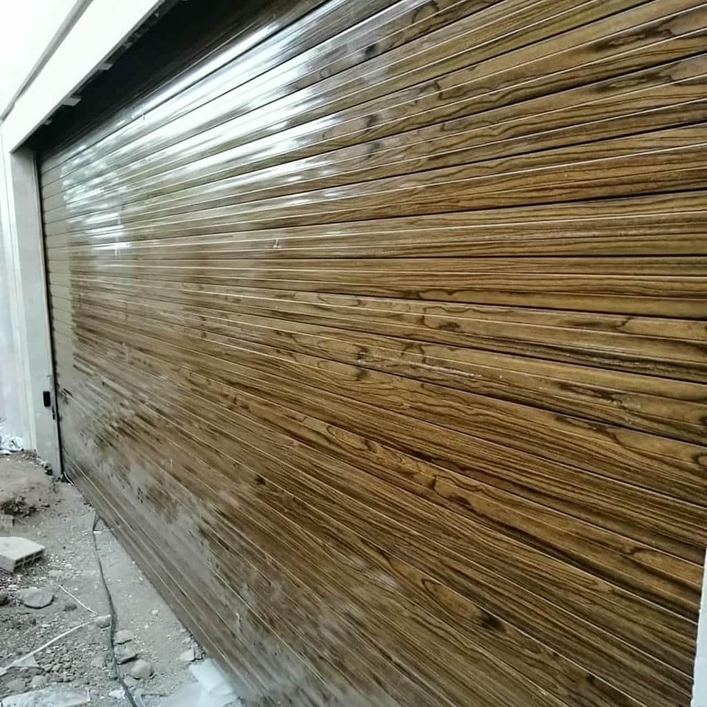 نصب درب کرکره ای پارکینگ اتوماتیک روی فریم مقاوم