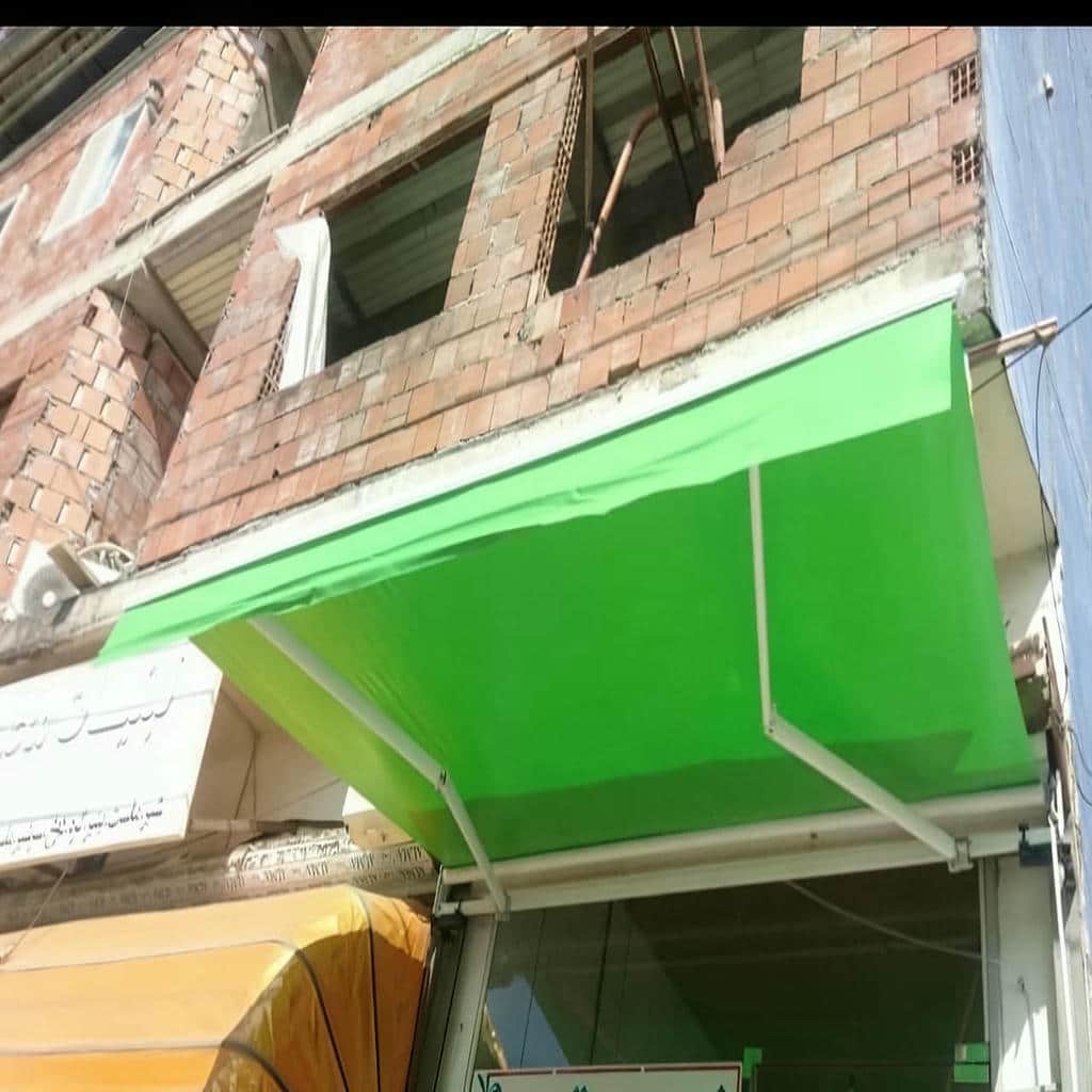 سایبان برقی در سنندج روی تراس آپارتمانی